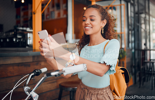 Image of Bicycle, smartphone and black woman in city using phone for social media, carbon footprint and outdoor online communication. Student, travel bike and 5g cellphone internet search for urban wellness