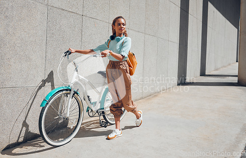 Image of Bike, young city woman and use bicycle on a summer day outdoor with trendy fashion, edgy or casual look. Girl relax, riding and lower carbon footprint for sustainability or eco friendly transport