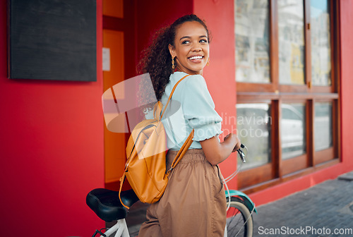 Image of Happy, smile and woman with a bicycle in the city for carbon footprint with a backpack on a walk. Happiness, cycling and girl from Mexico walking with bike in the urban street while on summer holiday