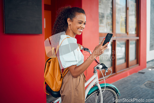 Image of Phone, bike and travel with a woman on social media while pushing her bicycle through the city on a trip. Mobile, cycling and transport with a young female traveling abroad or overseas alone