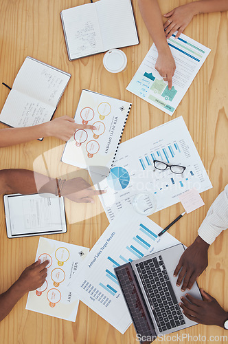 Image of Web development, charts and people meeting, planning and working on a strategy in collaboration at work. Top view of team of designer with idea and analysis of data for growth of online website