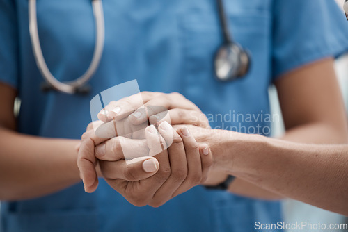Image of Hand holding, staff and hospital community with trust, support and hope in a clinic. Healthcare nurse, medical doctor and workers hands together to show work solidarity and team comfort care