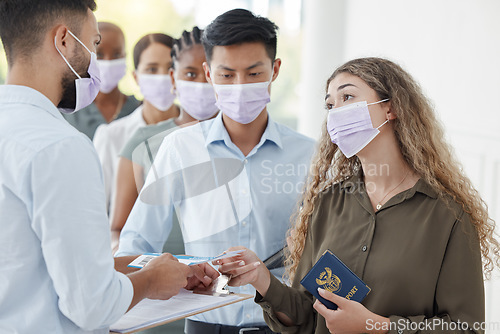 Image of Covid, travel and airport with a woman passenger in line with identity documents checking in with security for boarding a flight. Ticket, restrictions and safety with a female traveler in a mask