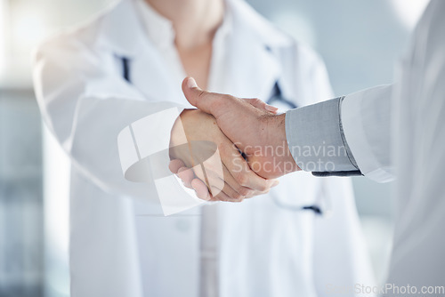 Image of Handshake, medical and doctors have agreement on patient health, illness treatment plan or diagnosis in clinic. Professional nurse, promotion or solution for virus, medicine or healthcare in hospital