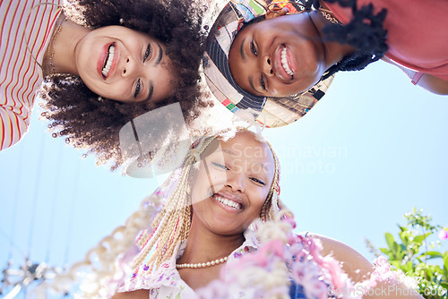 Image of Happy, smile and gen z friends huddle during holiday in summer in the city of California with blue sky from below. Relax, comic and face portrait of a group of African women on a vacation together