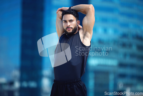 Image of Man stretching for fitness training in city, running for cardio exercise and workout for strong body motivation. Commitment, healthy and sports runner or athlete ready for sport competition in Dubai