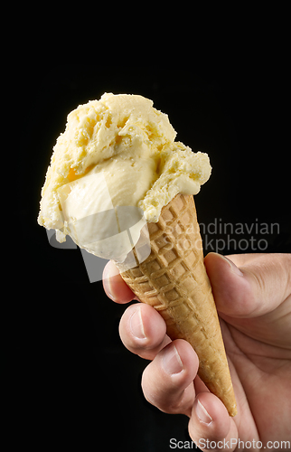 Image of vanilla ice cream in waffle cone