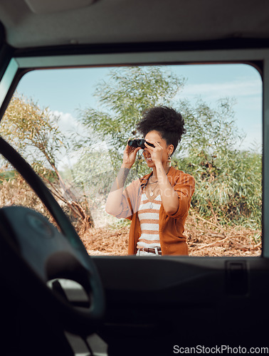 Image of Road trip, travel and binoculars with a sightseeing woman outdoor in nature for a summer vacation or weekend getaway. Freedom, holiday and vehicle with a female standing by her car while traveling