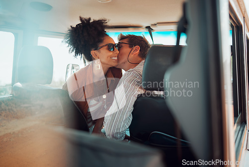 Image of Love, couple and cheek kiss on road trip, vacation or summer holiday trip. Sunglasses, diversity and man kissing woman, affection or bonding, care or romance on car drive and spending time together.