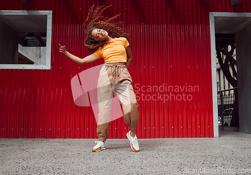 Image of City, hip hop dance and an urban black woman in streetwear dancing outside in Sao Paulo. Music, dancer and a cool happy latino girl with outdoor street style, fun energy, freedom and youth in Brazil.