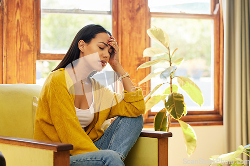 Image of Headache, stress or Brazilian woman with mental health or burnout anxiety in house living room, home or counseling. Depression, exhausted or tired psychology patient thinking in wellness help therapy