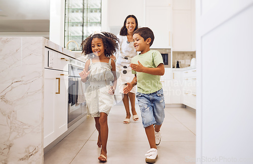 Image of Mother, kids play together running game and family bonding in kitchen at home. Smiling playful mother, happy excited energetic children and actively enjoying fun leisure indoor activity with mom