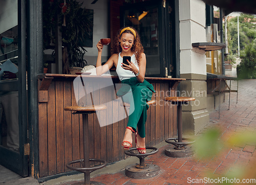 Image of Phone, social media and coffee with a black woman customer at a cafe counter on the sidewalk. Coffee shop, internet and communication with a young female typing a text message in a restaurant