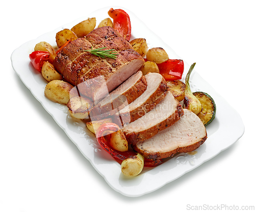 Image of sliced roast pork with vegetables