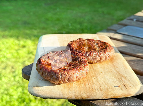 Image of freshly grilled burgers