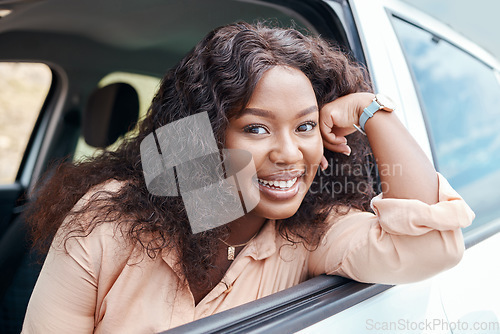 Image of Black woman, happy and smile at window of car on road trip, travel or vacation. Portrait, woman and driver with happiness in transport on road, street or drive in sunshine outdoor in Cape Town