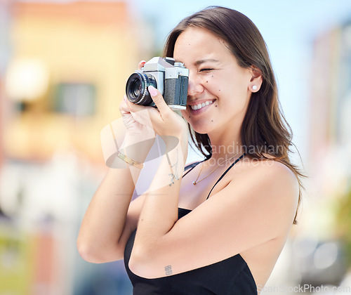 Image of Photographer, city photography and digital camera woman take urban photoshoot for memory on world, global or international travel. Vacation tour, smile and happy asian girl shooting outdoor Singapore