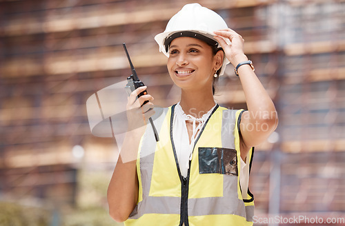 Image of Woman engineer, construction and communication with walkie talkie, technology and safety check working. Construction worker, industry and protection helmet, radio supervision and leadership.