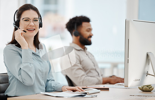 Image of Contact us, call center and happy woman in insurance sales talking, helping and working at a customer service desk. Smile, telecom and telemarketing agent consulting or speaking on headset in Toronto