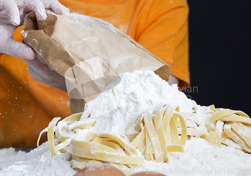 Image of a child with a bag of flour