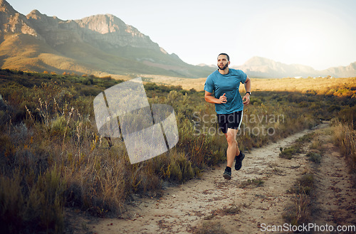 Image of Fitness, mountain and runner running on a trail in nature for exercise, training and cardio workout outdoors. Sports, challenge and active athlete with endurance, discipline and healthy body in Italy