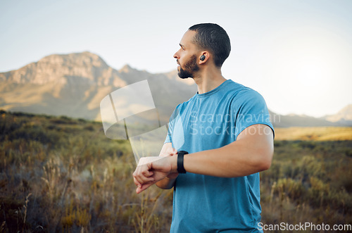 Image of Exercise, thinking man and outdoor for view, workout or enjoy nature with digital watch for endurance. Wellness, fitness or healthy male in sportswear, peaceful outside for health or trainer stamina