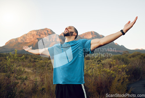 Image of Mountain, sports man hands celebrate victory after fitness hike or climbing cardio adventure. Young happy male athlete, arms raised and wellness travel workout or outdoor runner success