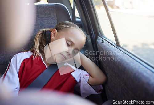 Image of Soccer, travel and girl sleeping in a car tired from sports practice, training and fitness workout for children. Transportation, relaxing and young kid resting and dreaming peacefully after football