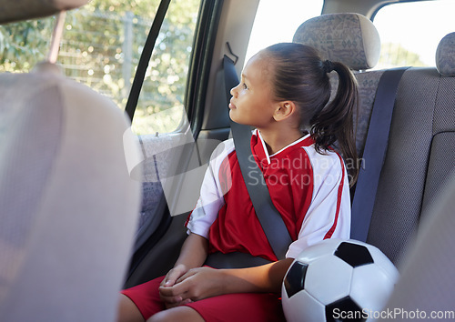 Image of Child in car interior, travel transport to football and soccer athlete sitting in motor vehicle. Young sports athlete in Brazil fitness training, journey to game in back seat and kid safety seat belt