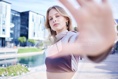 Image of City, hand frame and portrait of woman in street, model for fashion, beauty and makeup. Summer, freedom and trendy young girl in the road of urban town with hands for creative, modern and edgy style