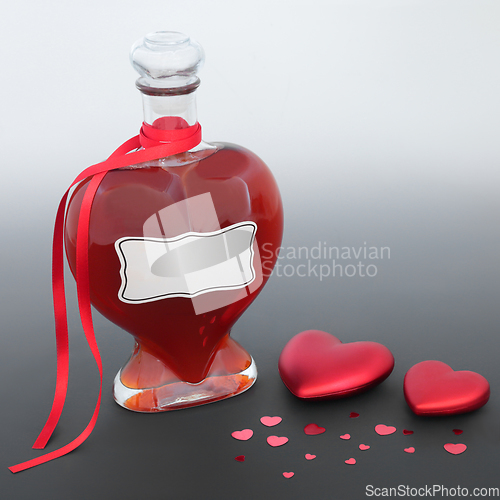 Image of Love Potion Bottle with Red Heart Decorations