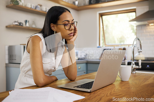 Image of Stress, burnout and laptop with woman in kitchen with mental health, tired or depression from remote work. Review, sad and research with bored girl reading email at home for news, idea and technology
