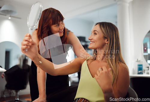 Image of Hairdresser, salon and hair, woman and mirror, happy about haircut in professional hairstyle boutique. Small business, consultation success with client and beauty, grooming and haircare.