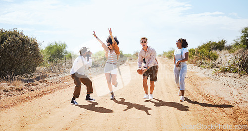 Image of Friends, road trip adventure and desert travel holiday together laugh while walking on dirt road in summer sun. Group diversity, vacation in nature and explore freedom traveling Australia countryside