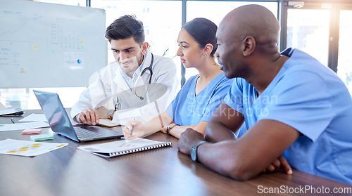 Image of Laptop, meeting and healthcare with a doctor team doing research in hospital boardroom for health or treatment. Computer, diagnosis and planning with a medical expert group discussing medicine