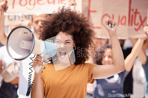 Image of Angry, megaphone and black woman leading a protest in the city of Iran for human rights. Portrait of a frustrated girl talking with a microphone and group of people for justice and equality in a riot