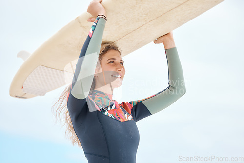 Image of Surf, happy and sports woman surfing athlete with a surfboard ready for fitness and exercise. Training motivation, workout and healthy water cardio of a person from Florida at the beach in summer