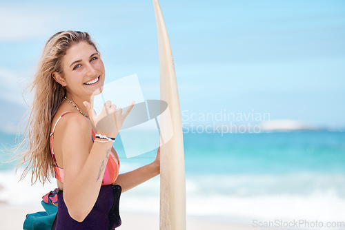 Image of Surfer hand sign, happy and surfing sport woman athlete ready for sports exercise in the sea waves. Portrait of water fitness, training and happiness of a person from workout at the ocean and beach