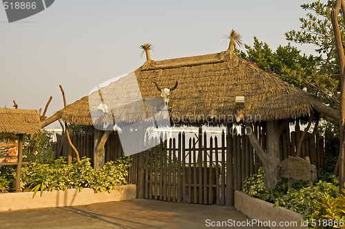 Image of Gated entrance with thatch roof