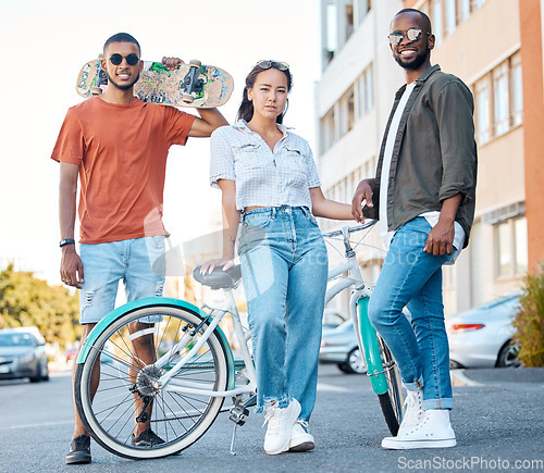 Image of Fashion, Gen Z and skater friends portrait in road for hangout in Los Angeles neighbourhood. Skateboard, bike and diverse friendship with trendy people gathering for street leisure together.