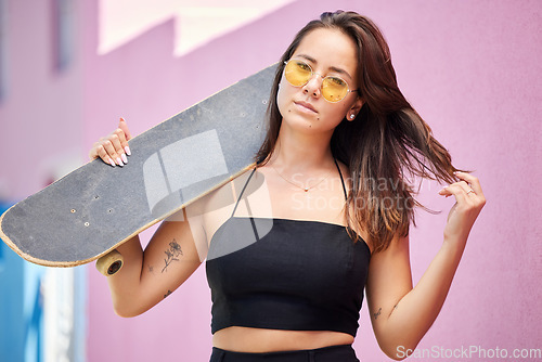 Image of Portrait of woman, sunglasses and skateboard retro look in urban city on street style adventure. Young asian trendy skater girl, gen z or millennial lifestyle and fun modern edgy fashion outdoors