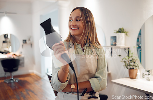 Image of Salon, hairdresser and woman with hairdryer for professional styling thinking and holding equipment. Smile of happy hair grooming girl with stylist expert heat tool enjoying calm contemplating moment