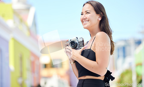 Image of Photography, summer and happy photographer with camera shooting pictures of colorful houses in the city. Smile, woman and creative freelancer takes a photo of Cape Town on a holiday vacation outdoors