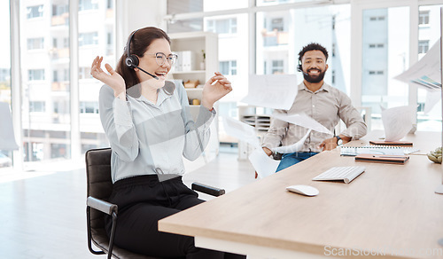 Image of Call center, customer service and excitement with a woman consultant celebrating sales at work on a headset. Ecommerce, contact us and crm with a surprised female happy at success in telemarketing