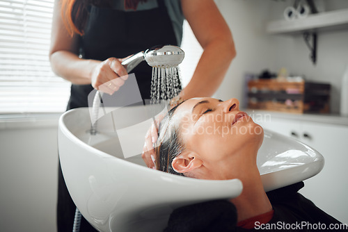 Image of A woman salon, hairdresser cleaning hair in sink and relax after haircare treatment for selfcare wellness. Professional hair stylist, beautician washing and styling lady hairstyle luxury beauty salon