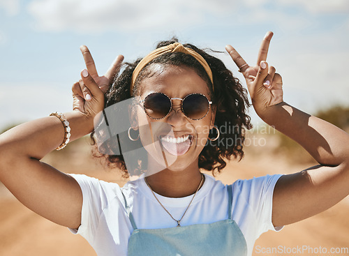 Image of Peace, portrait and happy gen z girl on summer holidays, vacation or having fun on a weekend outdoors. Freedom, traveling and young woman with cool, trendy and swag with a v hand sign in Las Vegas