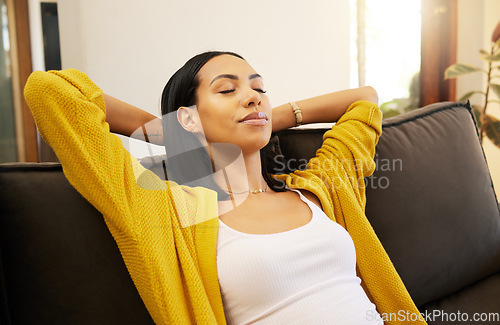 Image of Sleeping, relax and black woman on the sofa in the living room for peace in her house. Content, happy and African girl with sleep for wellness, freedom and calm on the couch in the lounge of her home