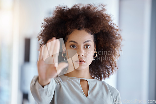 Image of Hands, hr and manager stop sign with hand in office, serious, power and change in corporate. Black woman fighting sexual harassment, discrimination and toxic work environment with employee protection
