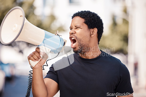 Image of Megaphone, protest and angry black man talking at riot in Nigeria. Announcement, loudspeaker and shouting or screaming male on bullhorn protesting for freedom, justice or government change in city.