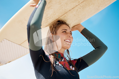 Image of Woman surfing board, beach sports and summer training for waves, freedom and happiness outdoors in Australia blue sky. Happy young surfer at ocean, sea and sunshine to relax, motivation and adventure